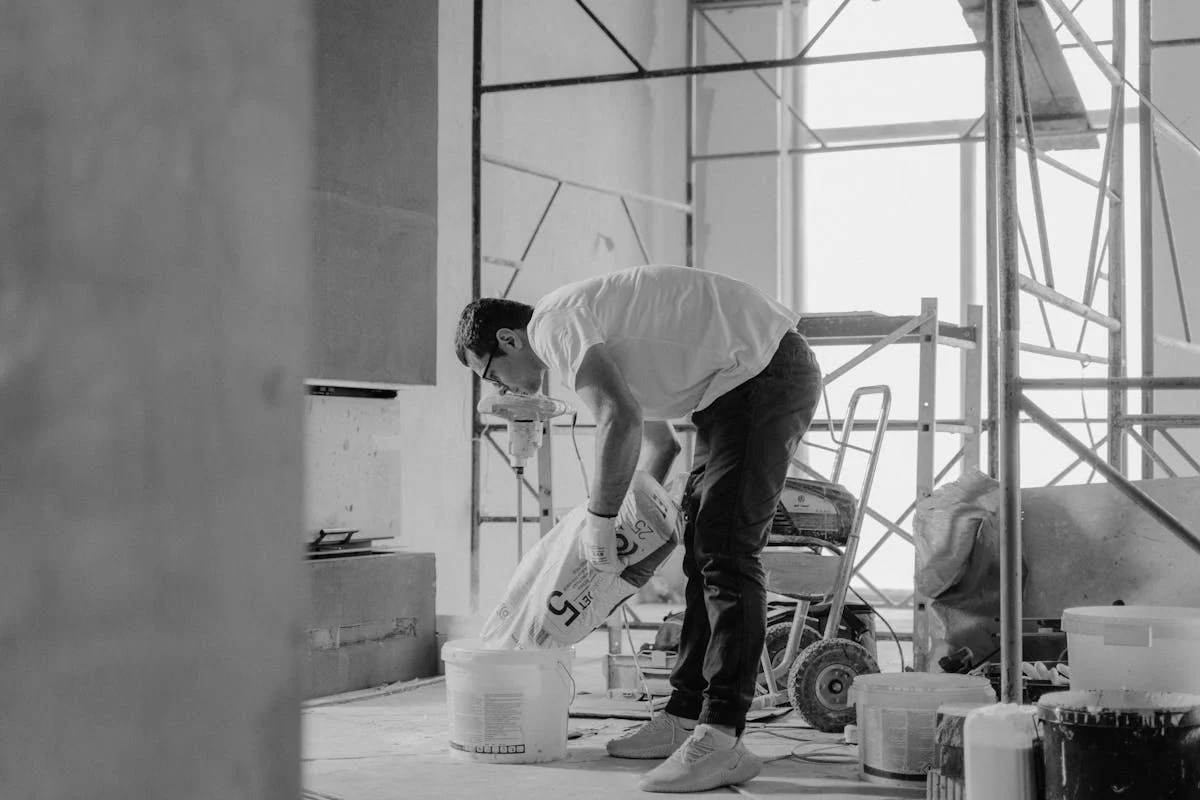 Contractors working on a home renovation project financed with a personal loan in Midvale, Utah